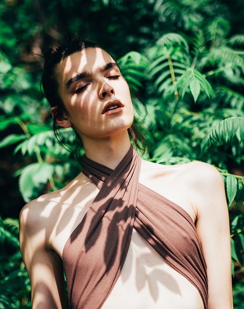 a genderqueer person experiencing Sacred Sexuality in nature